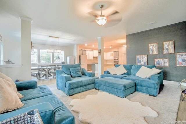 living room featuring ceiling fan