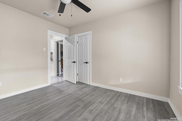 spare room featuring ceiling fan and wood-type flooring