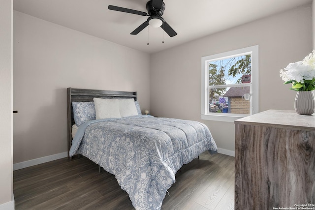 bedroom featuring ceiling fan and dark wood-type flooring