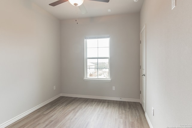 empty room with light hardwood / wood-style flooring and ceiling fan