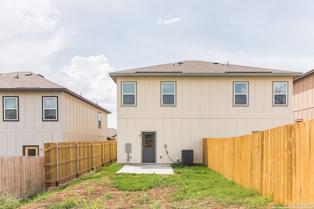 rear view of house with a patio area and central AC unit