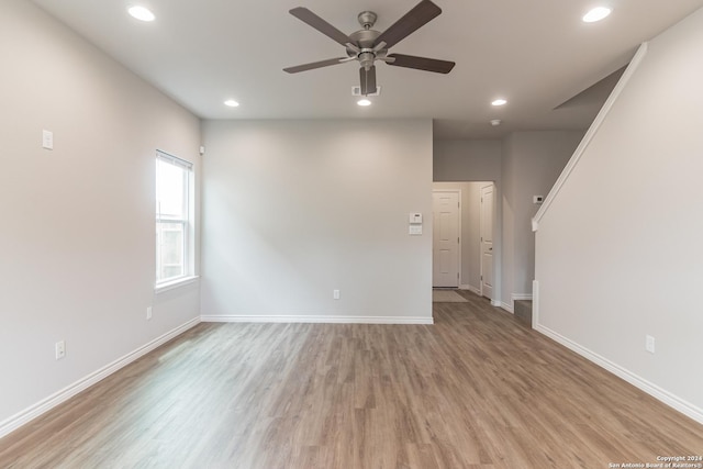 unfurnished room featuring light hardwood / wood-style floors and ceiling fan