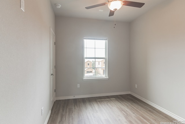 spare room featuring ceiling fan and light hardwood / wood-style floors