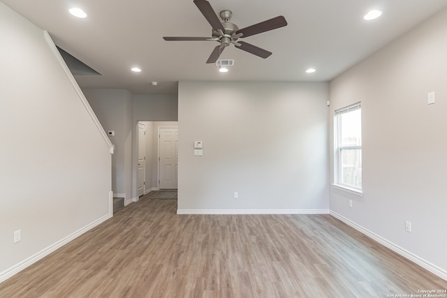 unfurnished room with ceiling fan and light hardwood / wood-style floors