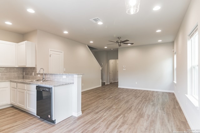 kitchen with white cabinetry, sink, light hardwood / wood-style flooring, and black dishwasher