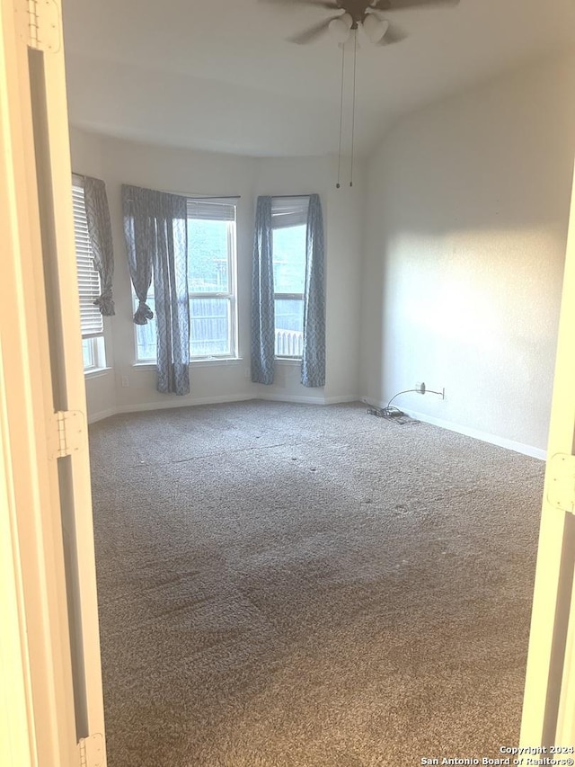 carpeted empty room with ceiling fan