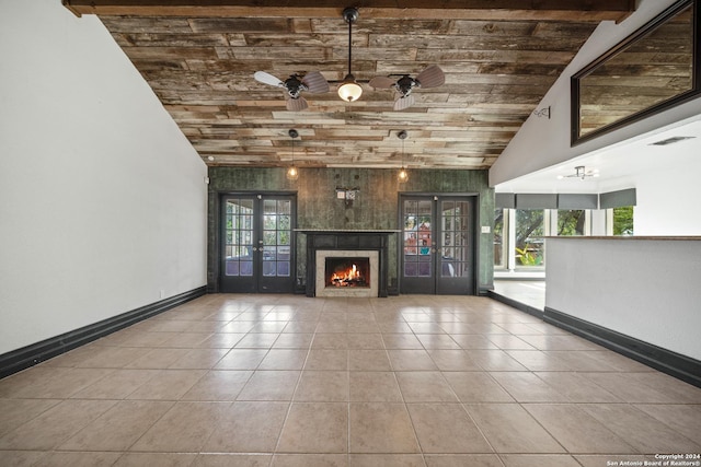 unfurnished living room with french doors, wooden walls, high vaulted ceiling, wooden ceiling, and light tile patterned flooring