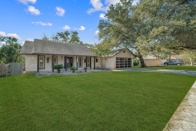 ranch-style house with a porch, a garage, and a front lawn