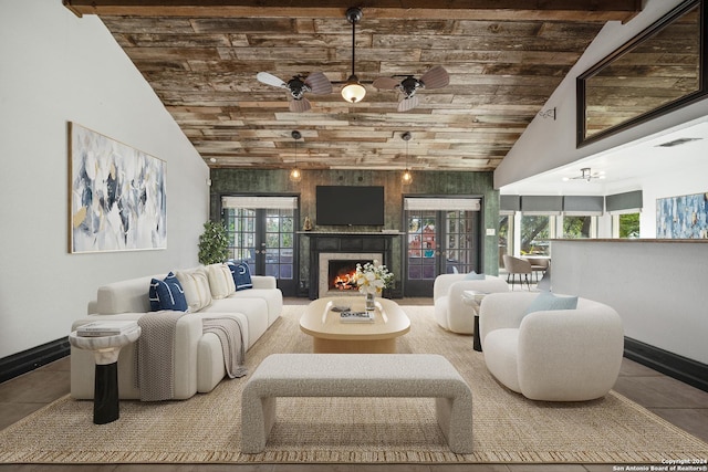 living room with ceiling fan, french doors, tile patterned floors, vaulted ceiling, and wood ceiling