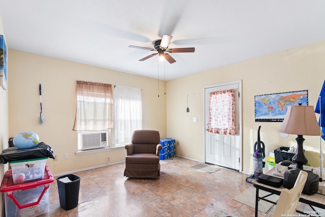 sitting room with ceiling fan and cooling unit