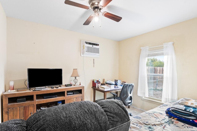 office area with carpet, ceiling fan, and a wall mounted AC