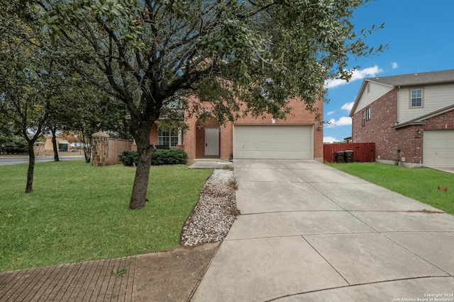 view of front of home with a garage and a front yard