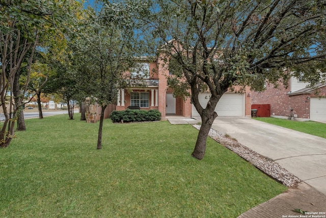 view of front facade featuring a front lawn and a garage