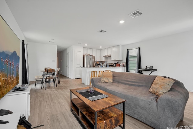 living room with light hardwood / wood-style floors