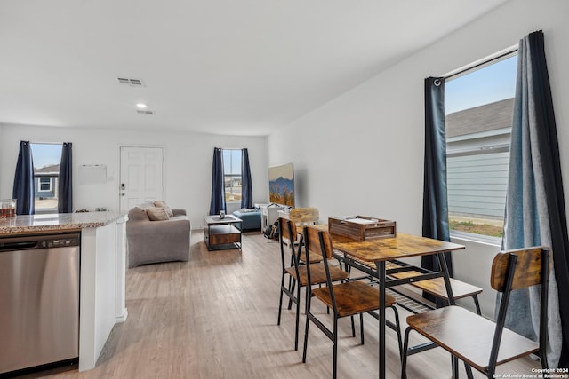 dining room with light wood-type flooring