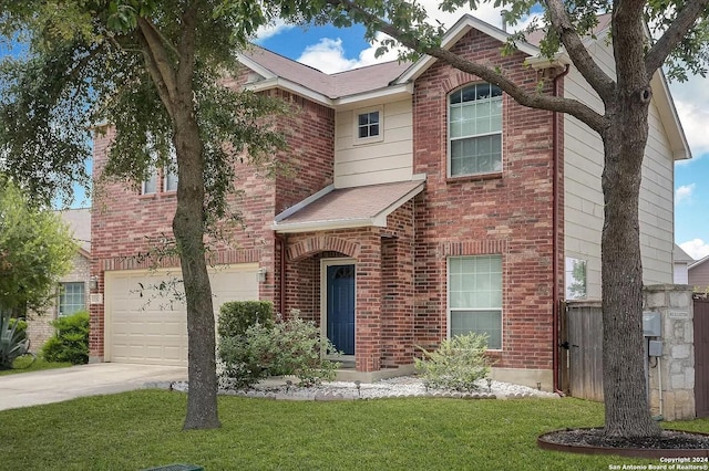 view of front of home with a garage and a front yard