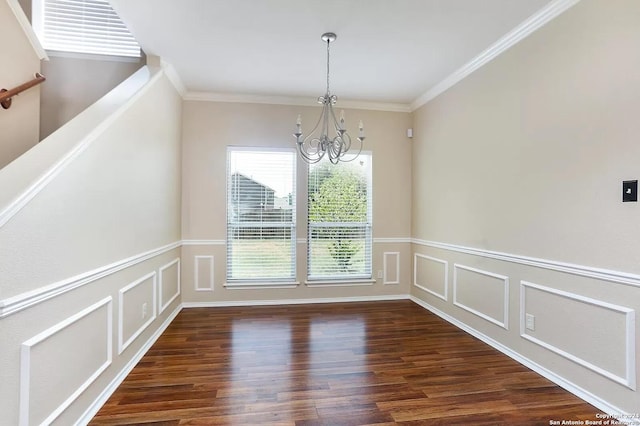 unfurnished dining area featuring ornamental molding, dark hardwood / wood-style floors, and a notable chandelier