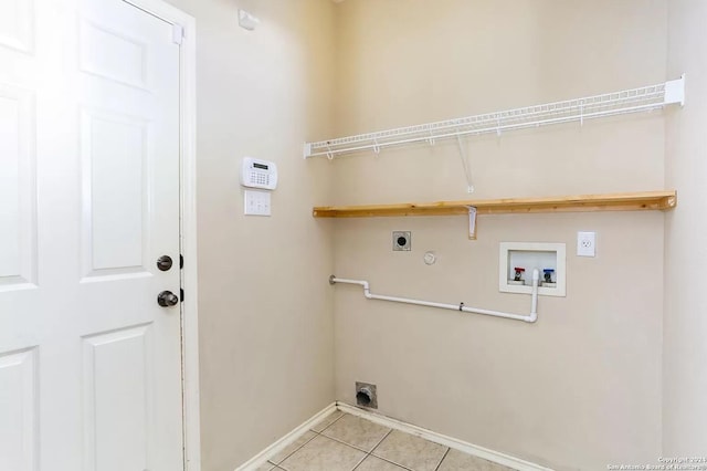 laundry room with hookup for a gas dryer, hookup for a washing machine, light tile patterned floors, and hookup for an electric dryer