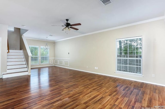 unfurnished living room featuring dark hardwood / wood-style floors, crown molding, ceiling fan with notable chandelier, and a wealth of natural light