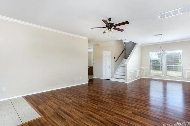 unfurnished living room with ceiling fan with notable chandelier, wood-type flooring, and ornamental molding