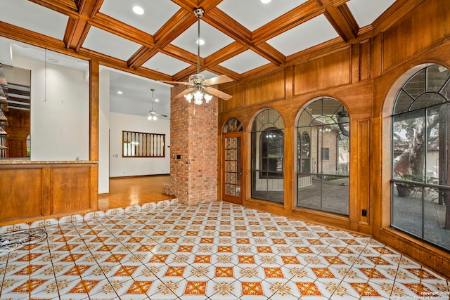 interior space featuring beam ceiling, ceiling fan, and coffered ceiling