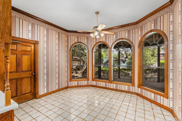 unfurnished sunroom with a wealth of natural light and ceiling fan