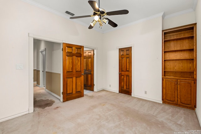 unfurnished bedroom with ceiling fan, light colored carpet, and ornamental molding