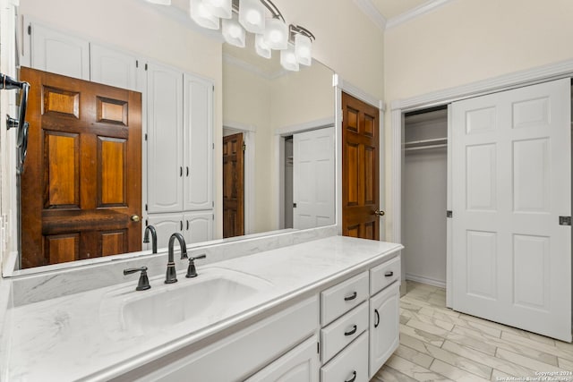 bathroom featuring vanity and ornamental molding