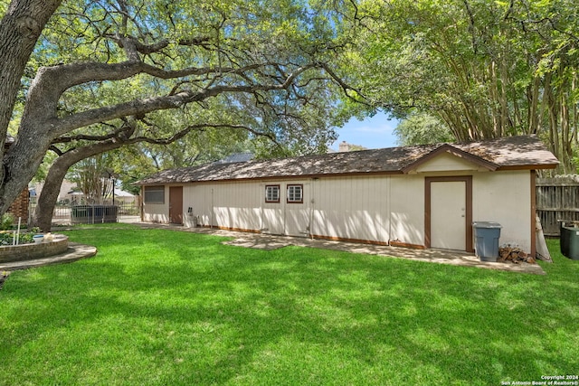 back of house featuring a yard