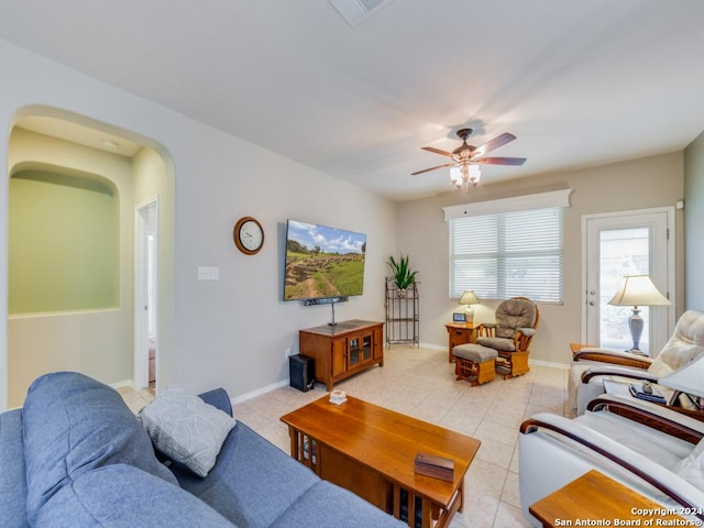 living room with ceiling fan and light tile patterned flooring