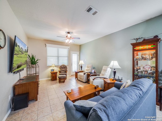 tiled living room featuring ceiling fan