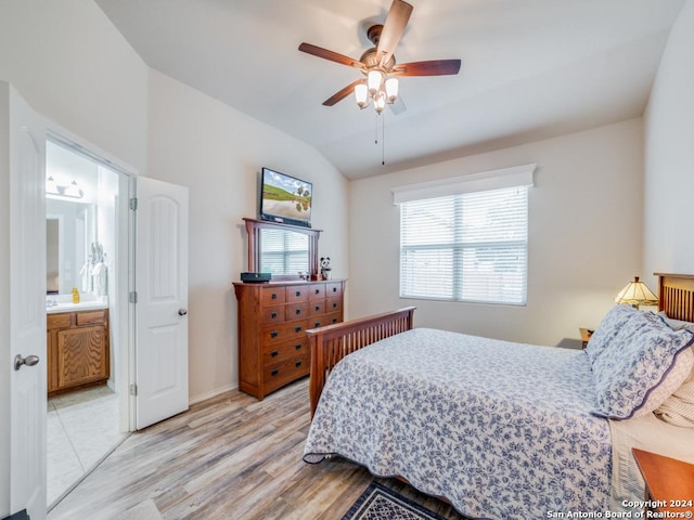 bedroom featuring multiple windows, ceiling fan, ensuite bathroom, and light hardwood / wood-style floors