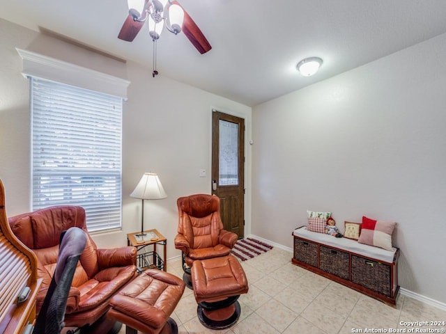 living area featuring ceiling fan