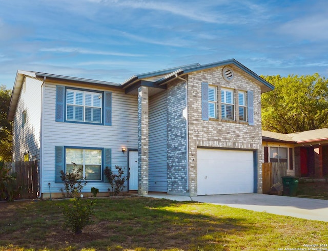 view of front of house featuring a front yard and a garage