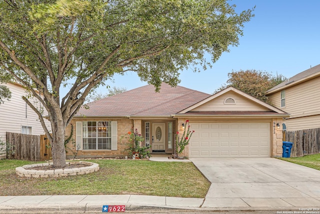 ranch-style house with a front lawn and a garage