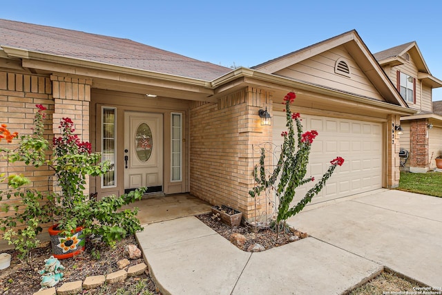 view of exterior entry featuring a garage