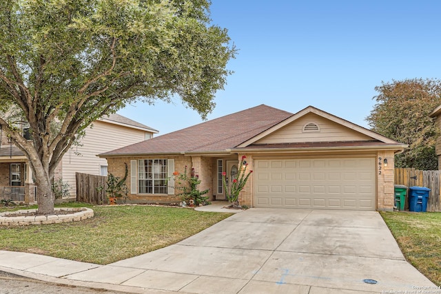 view of front of property with a garage and a front lawn