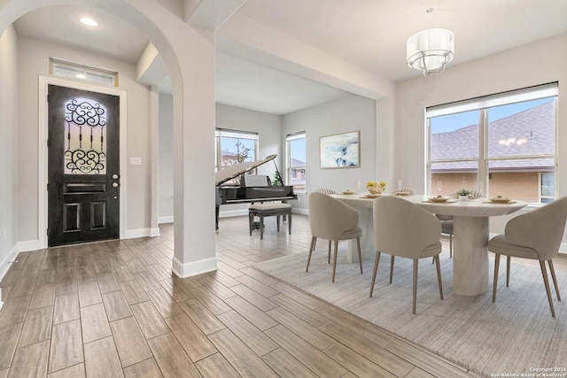 dining space featuring light wood-type flooring