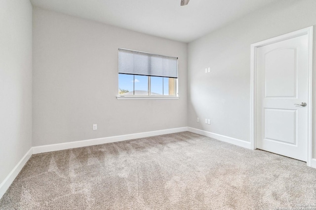 unfurnished room featuring carpet