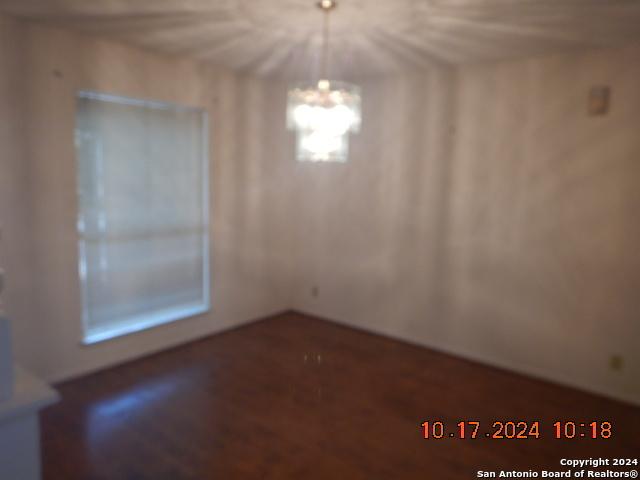 unfurnished dining area with a notable chandelier