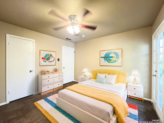 bedroom with ceiling fan and dark colored carpet