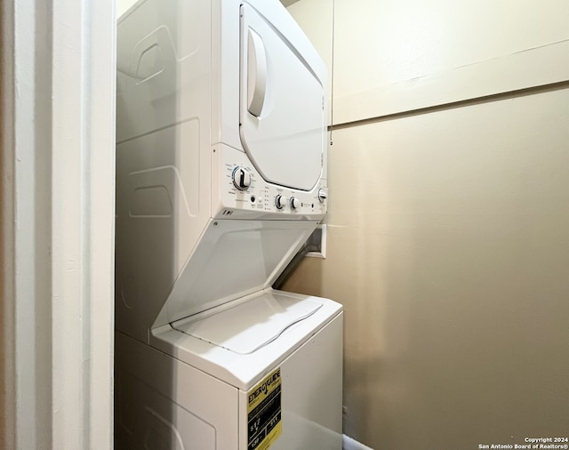 laundry room with stacked washer and clothes dryer