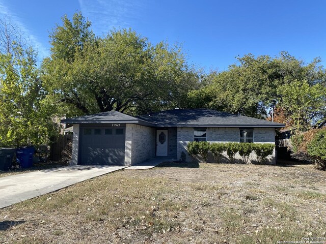 single story home with a garage