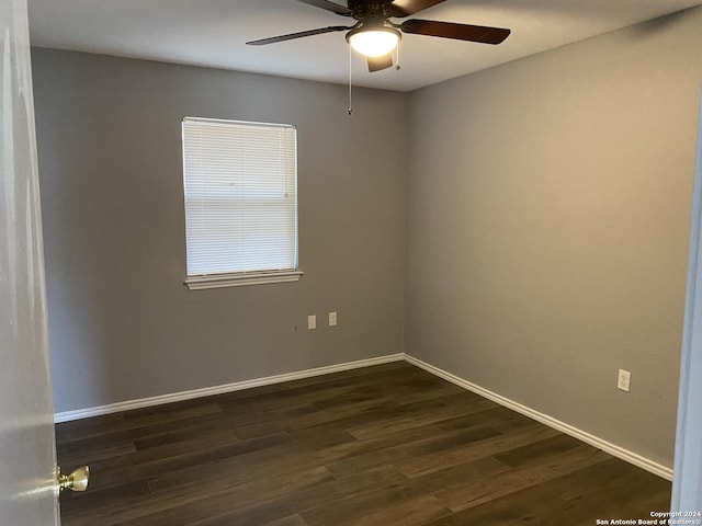 spare room with ceiling fan and dark hardwood / wood-style floors