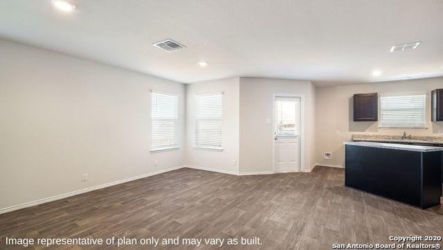 kitchen with hardwood / wood-style flooring and sink