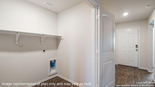 laundry room with hookup for an electric dryer, dark hardwood / wood-style floors, and gas dryer hookup