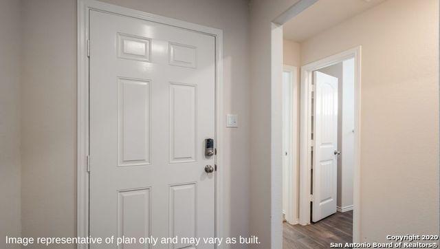 entryway with hardwood / wood-style floors