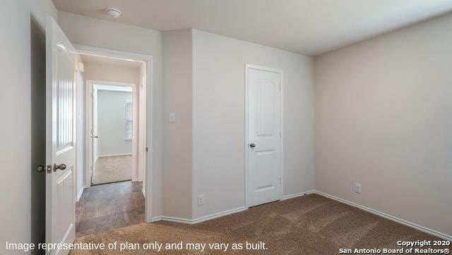 unfurnished bedroom with carpet and a closet