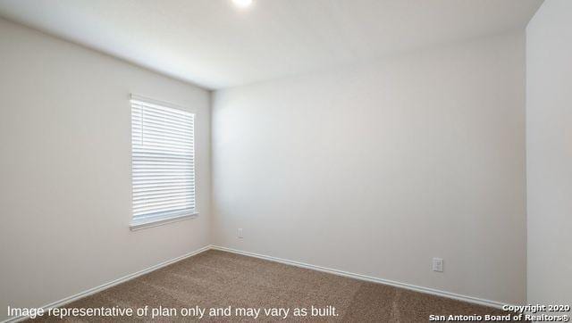 empty room featuring carpet flooring