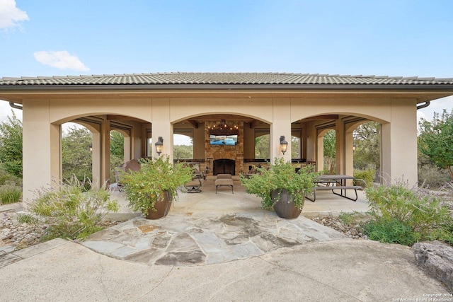 view of patio with a fireplace